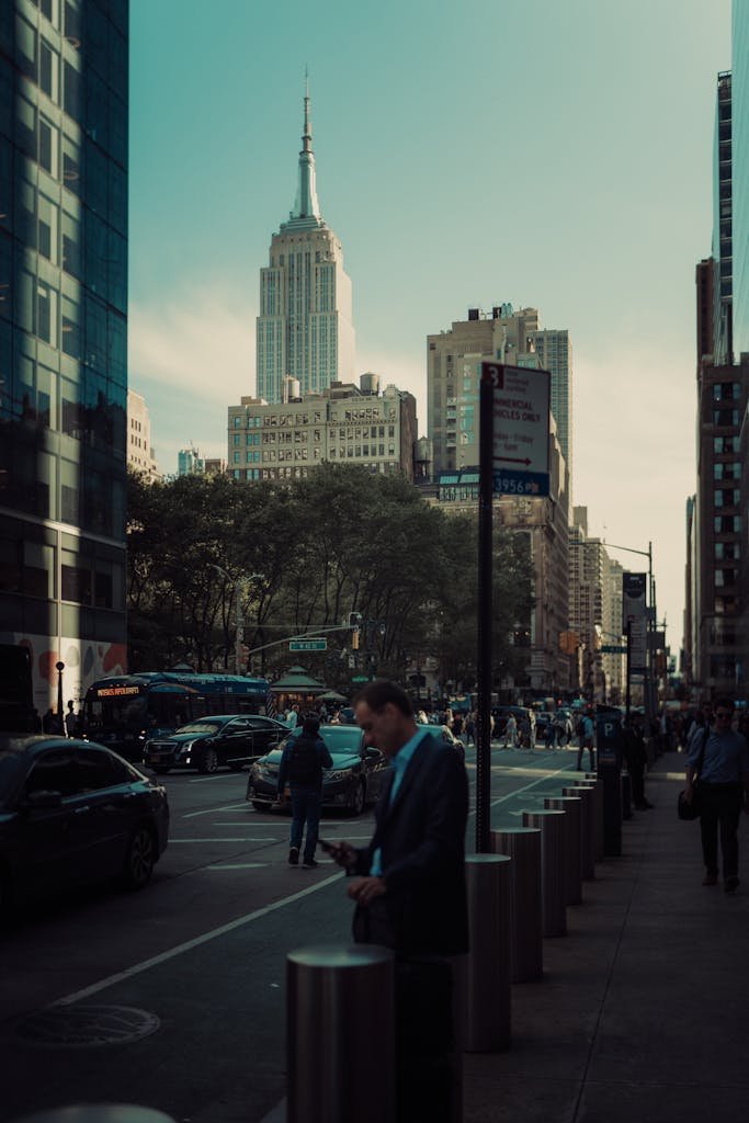 Vibrant city scene featuring pedestrians and the Empire State Building in New York.